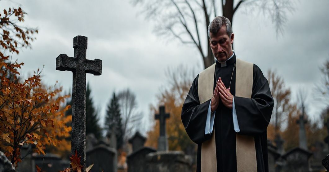 Sobótni katolicki cmentarz z kamiennym krzyżem, kapłanem w liturgicznych szatach i jesiennymi liśćmi podkreślającym powagę śmierci i konieczność łaski boskiej