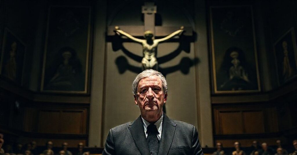 Portret Olafa Scholza podczas przemówienia przed komisją parlamentu Meklemburgii-Pomorza Przedniego na tle katolickiej symboliki.